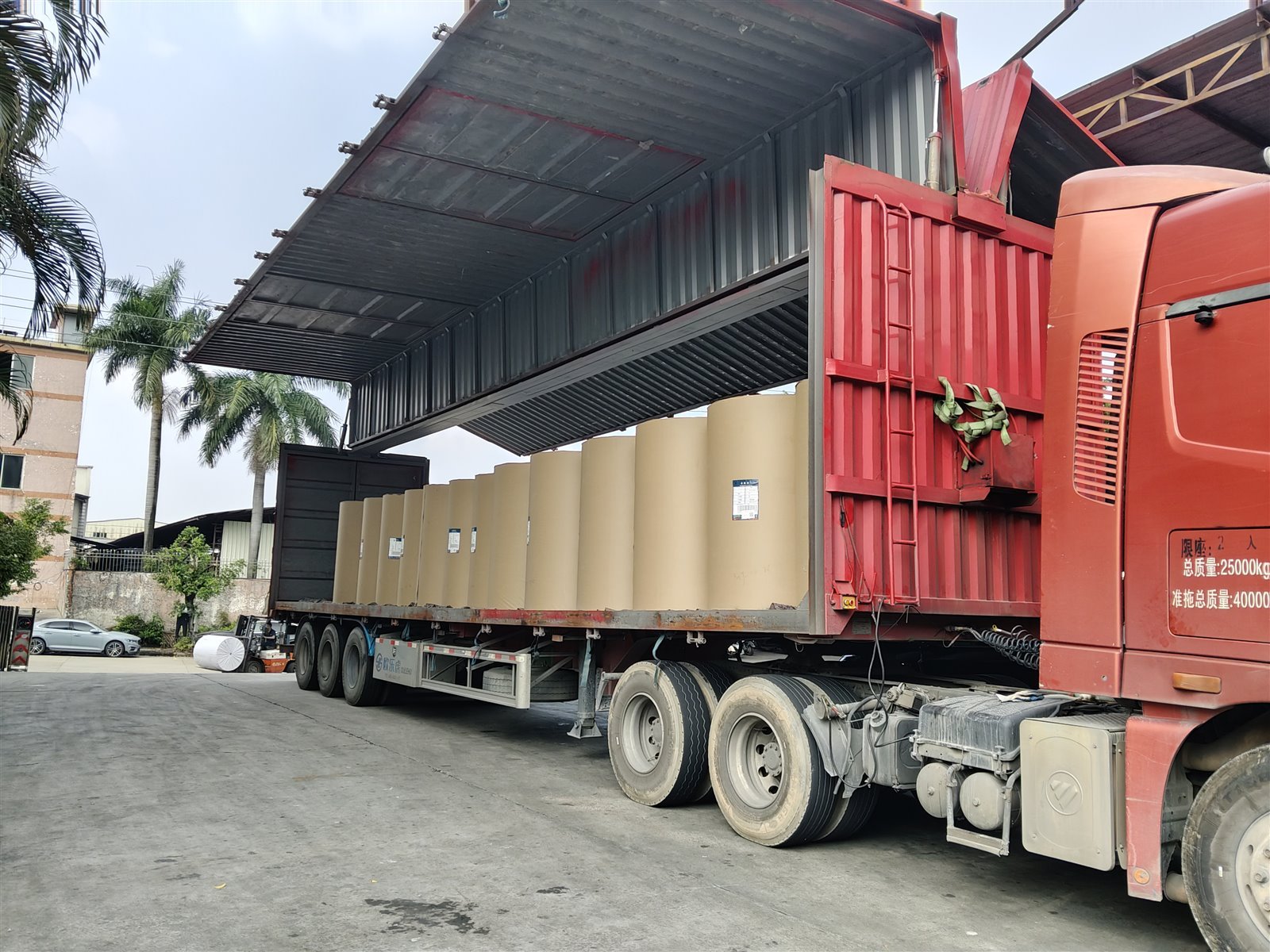 Packed roll materials being loaded for shipment